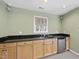 Close up of a bar area with a countertop and sink at 2514 Mcgowan Ct, Wake Forest, NC 27587