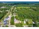 Aerial view of a community with tree-lined streets and diverse housing options at 2616 Bullock Rd, Durham, NC 27704