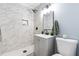 Updated bathroom with marble tile shower, modern vanity, and fixtures at 2616 Bullock Rd, Durham, NC 27704