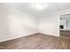 Bedroom with wood floors and neutral walls at 2616 Bullock Rd, Durham, NC 27704