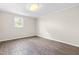 Bedroom with wood floors and natural light at 2616 Bullock Rd, Durham, NC 27704