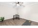 Bedroom with wood floors and light paint, featuring an area for an office or workout space at 2616 Bullock Rd, Durham, NC 27704