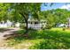 Lovely one-story home with a welcoming front porch, surrounded by mature trees and a well-maintained lawn at 2616 Bullock Rd, Durham, NC 27704