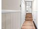 Hallway with wood floors leading to the living area and stairs at 2616 Bullock Rd, Durham, NC 27704