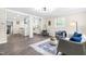 Open-concept living and kitchen area with modern flooring and stylish decor, perfect for entertaining at 2616 Bullock Rd, Durham, NC 27704