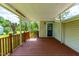 Covered porch with wood deck overlooking the yard at 2616 Bullock Rd, Durham, NC 27704