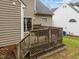 Back deck with stairs leading to the yard, perfect for outdoor entertaining and relaxation at 2825 Alder Ridge Ln, Raleigh, NC 27603