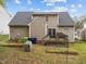 Backyard features include a patio, lawn, and view of the home's exterior siding at 2825 Alder Ridge Ln, Raleigh, NC 27603