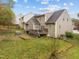 View of the backyard featuring a deck, lawn, and the exterior of the home at 2825 Alder Ridge Ln, Raleigh, NC 27603