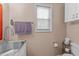 Functional half bathroom featuring modern fixtures, vanity sink, and a toilet at 2825 Alder Ridge Ln, Raleigh, NC 27603