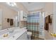 Bathroom featuring stylish vanity, recessed lighting, and patterned shower curtain at 2825 Alder Ridge Ln, Raleigh, NC 27603