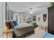 Cozy bedroom features neutral walls, ceiling fan and comfortable bed, inviting a restful retreat at 2825 Alder Ridge Ln, Raleigh, NC 27603