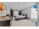 Comfortable bedroom with neutral carpeting, ceiling fan, and window bringing in lots of natural light at 2825 Alder Ridge Ln, Raleigh, NC 27603