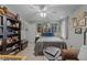 Bedroom features neutral walls, fan, and comfortable bed, complemented by personal decor and shelving at 2825 Alder Ridge Ln, Raleigh, NC 27603