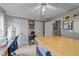 Bright craft room with white trim, ceiling fan, sewing table and abundant storage cabinets at 2825 Alder Ridge Ln, Raleigh, NC 27603