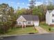 A single-Gathering home in a quiet neighborhood with a well-kept lawn and an attached single car garage at 2825 Alder Ridge Ln, Raleigh, NC 27603