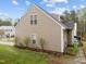 View of the home's exterior showcasing siding, windows, and landscaped yard at 2825 Alder Ridge Ln, Raleigh, NC 27603