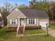 Charming single Gathering home featuring a manicured lawn, flowering bushes, and an attached one car garage at 2825 Alder Ridge Ln, Raleigh, NC 27603