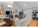 Bright living room featuring vaulted ceilings, a fireplace, and hardwood floors at 2825 Alder Ridge Ln, Raleigh, NC 27603