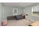 Bright bedroom features a twin bed, soft carpet, and a window providing lots of natural light at 297 Lane Store Rd, Franklinton, NC 27525