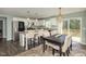 Bright eat-in kitchen with granite countertops, stainless appliances, and white cabinetry at 297 Lane Store Rd, Franklinton, NC 27525