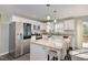 Modern kitchen with stainless appliances, granite countertops, and a breakfast bar at 297 Lane Store Rd, Franklinton, NC 27525
