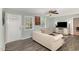 Cozy living room with wood-look floors, neutral paint, and lots of natural light at 297 Lane Store Rd, Franklinton, NC 27525
