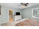 Spacious main bedroom with a ceiling fan, a large window, and access to the bathroom at 297 Lane Store Rd, Franklinton, NC 27525