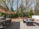 Inviting backyard with patio seating, a fire pit, and a well-maintained lawn at 3037 Willow Ranch Dr, Fuquay Varina, NC 27526