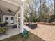 Spacious outdoor patio with seating and a fire pit in the backyard at 3037 Willow Ranch Dr, Fuquay Varina, NC 27526