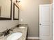 Elegant bathroom with granite countertops and dual sinks at 3037 Willow Ranch Dr, Fuquay Varina, NC 27526