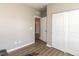 Clean bedroom space with hardwood floors and closet at 3037 Willow Ranch Dr, Fuquay Varina, NC 27526