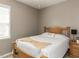 Cozy guest bedroom featuring a wooden bed frame, neutral walls, and natural light at 3037 Willow Ranch Dr, Fuquay Varina, NC 27526