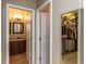 Hallway view leading to a half bathroom and walk-in closet at 3037 Willow Ranch Dr, Fuquay Varina, NC 27526