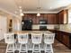 Modern kitchen boasts a granite island, stainless steel appliances, and a subway tile backsplash at 3037 Willow Ranch Dr, Fuquay Varina, NC 27526