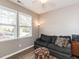 Cozy living room with natural light, featuring a comfortable sofa and stylish decor at 3037 Willow Ranch Dr, Fuquay Varina, NC 27526