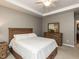 Comfortable main bedroom with a wooden bed frame and matching dresser at 3037 Willow Ranch Dr, Fuquay Varina, NC 27526