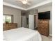 Bright main bedroom features a ceiling fan and dresser with mirror and TV at 3037 Willow Ranch Dr, Fuquay Varina, NC 27526