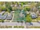 Aerial view of a charming home with a spacious yard in a tree-lined neighborhood at 309 W Parrish Dr, Benson, NC 27504