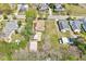 Aerial view of a charming home, complemented by an expansive yard and convenient outbuildings at 309 W Parrish Dr, Benson, NC 27504
