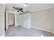 Bedroom featuring a large built-in wardrobe with drawers and carpeted floor at 309 W Parrish Dr, Benson, NC 27504