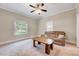 Bright and airy bedroom with large windows and neutral decor, offering a relaxing retreat at 309 W Parrish Dr, Benson, NC 27504