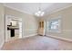 Open dining area with a cabinet for storage, a view into the kitchen, and natural light at 309 W Parrish Dr, Benson, NC 27504