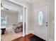 Inviting foyer featuring hardwood floors, decorative front door and a view to the living room at 309 W Parrish Dr, Benson, NC 27504