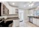 Modern kitchen featuring white cabinetry, granite countertops, and stainless steel appliances at 309 W Parrish Dr, Benson, NC 27504