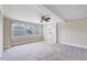 Spacious living room with carpeting, neutral paint colors and lots of natural light at 309 W Parrish Dr, Benson, NC 27504