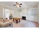 Spacious living room with fireplace, built-in shelving, and beautiful trim and carpet at 309 W Parrish Dr, Benson, NC 27504