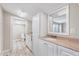Main bathroom with double sink vanity, custom cabinets and large mirror at 309 W Parrish Dr, Benson, NC 27504