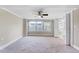 Spacious main bedroom with carpeting, neutral paint colors, fan and lots of natural light at 309 W Parrish Dr, Benson, NC 27504