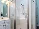 Bathroom with a glass-enclosed shower, white cabinetry, and modern fixtures at 3100 Anderson Dr, Raleigh, NC 27609